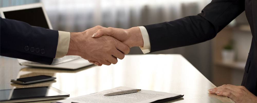 business-partners-shaking-hands-after-contract-signing-companies-picture-.jpg